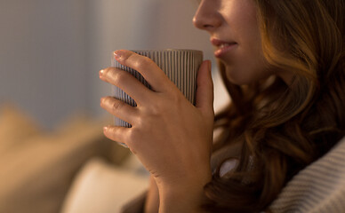 Image showing close up of happy woman with cup of coffee at home