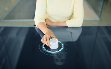 Image showing woman with control knob on interactive panel