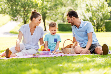 Image showing happy family having picnic at summer park