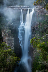 Image showing Enchanting Carrington Falls with wind blowing spray off waterfall