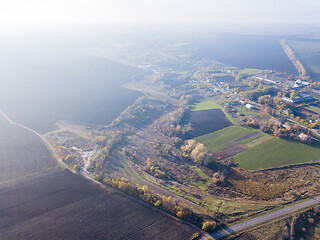 Image showing Aerial view from the drone above agricultural fields, manufacturing areas and landfill site.