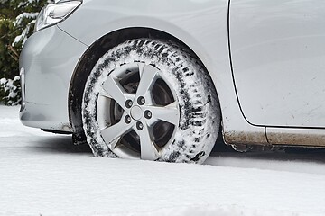 Image showing Car tyre in snow