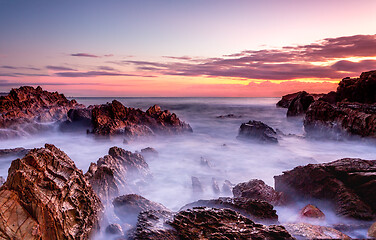 Image showing Rocky coastal seascape at dawn