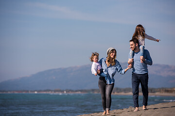 Image showing Young family enjoying vecation during autumn