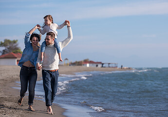 Image showing Young family enjoying vecation during autumn