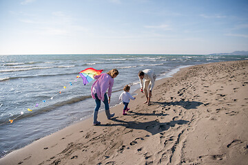 Image showing happy family enjoying vecation during autumn day