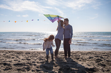 Image showing happy family enjoying vecation during autumn day