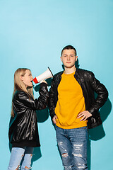 Image showing Portrait of young emotional female student with megaphone