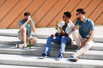 Image showing man photographing friends drinking beer on street