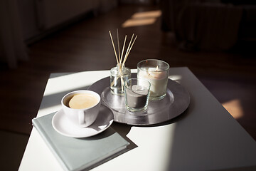 Image showing coffee, candles and aroma reed diffuser on table