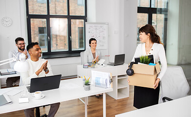 Image showing colleagues applauding to female office worker