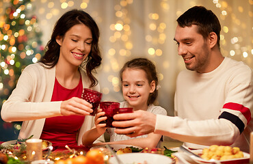 Image showing happy family having christmas dinner at home