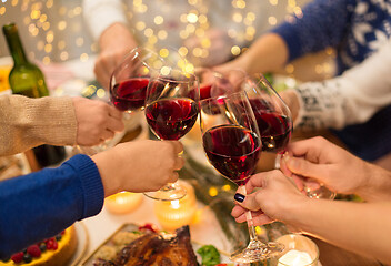 Image showing close up of friends with wine celebrate christmas