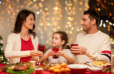 Image showing happy family having christmas dinner at home
