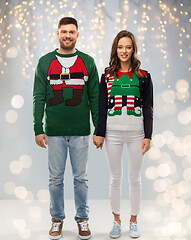 Image showing happy couple at christmas ugly sweater party