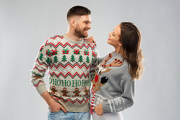 Image showing happy couple at christmas ugly sweater party