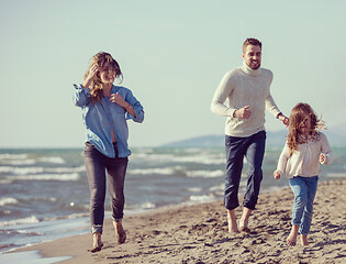 Image showing Young family enjoying vecation during autumn