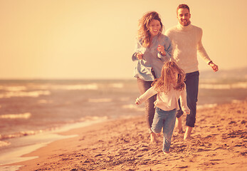 Image showing Young family enjoying vecation during autumn