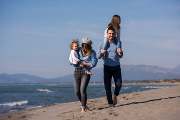 Image showing Young family enjoying vecation during autumn