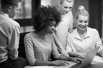 Image showing Multiethnic startup business team in night office