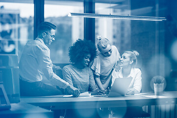 Image showing Multiethnic startup business team in night office