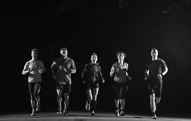 Image showing runners team on the night training