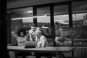 Image showing Multiethnic startup business team in night office