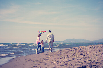 Image showing happy family enjoying vecation during autumn day