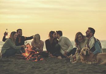Image showing Friends having fun at beach on autumn day