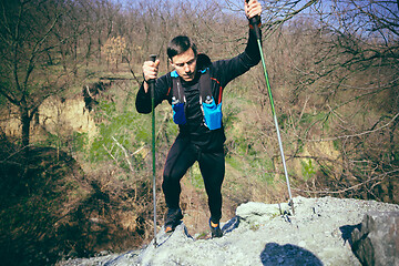 Image showing Hiker - man hiking in forest.