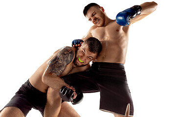 Image showing Two professional boxers boxing isolated on white studio background