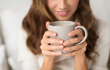 Image showing close up of happy woman with cup of coffee at home