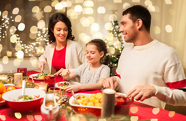 Image showing happy family having christmas dinner at home