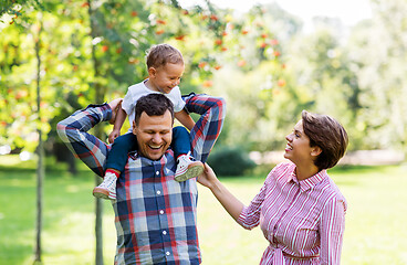 Image showing happy family having fun at summer park