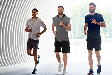 Image showing male friends with earphones running outdoors