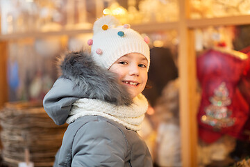 Image showing happy little girl at christmas market in winter