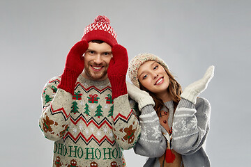 Image showing happy couple at christmas ugly sweater party