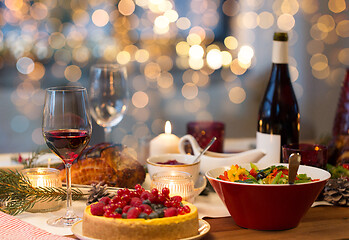 Image showing food and drinks on christmas table at home