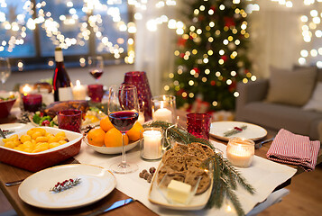 Image showing food and drinks on christmas table at home