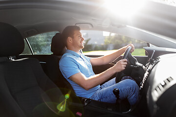 Image showing smiling man or driver driving car