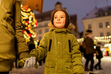 Image showing happy little boy with mother at christmas market