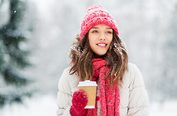 Image showing happy teenage girl with coffee in winter park
