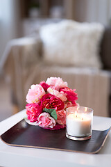 Image showing burning fragrance candle and flower bunch at home