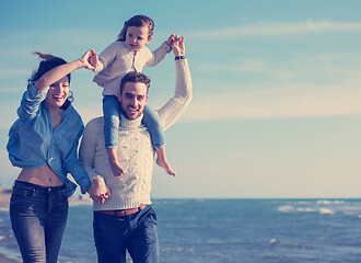 Image showing Young family enjoying vecation during autumn