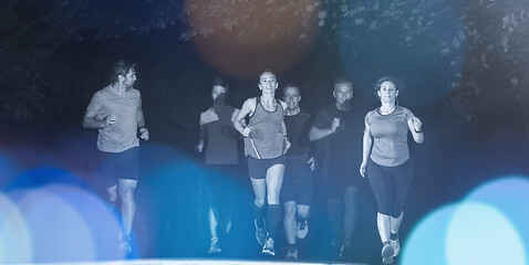 Image showing runners team on the night training