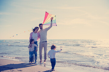 Image showing happy family enjoying vecation during autumn day