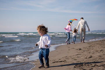 Image showing happy family enjoying vecation during autumn day