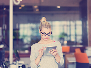 Image showing woman working on digital tablet in night office