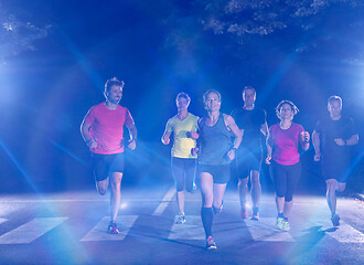 Image showing runners team on the night training