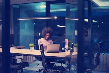 Image showing black businesswoman using a laptop in startup office